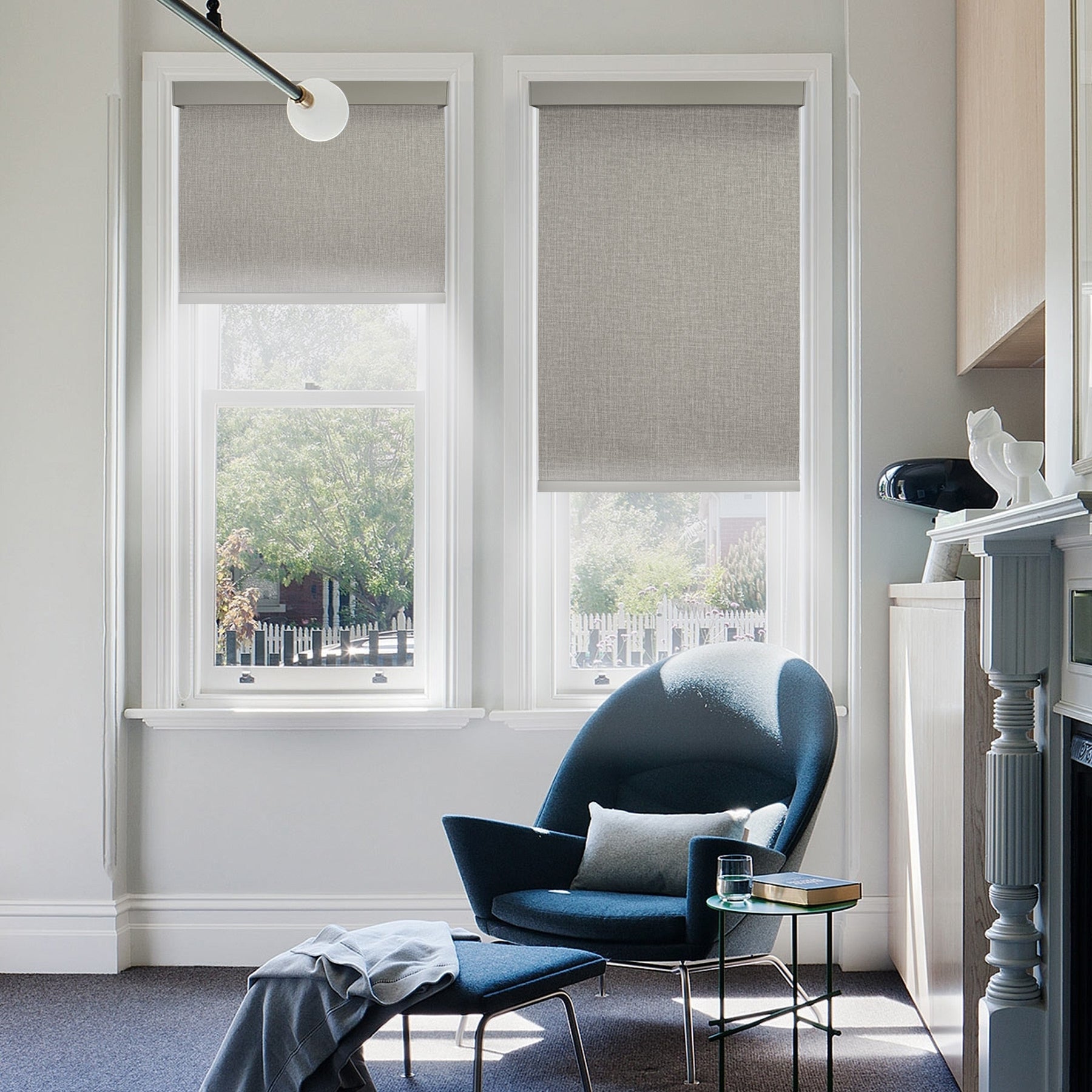 motorized blackout roller shades with square cassette in living room