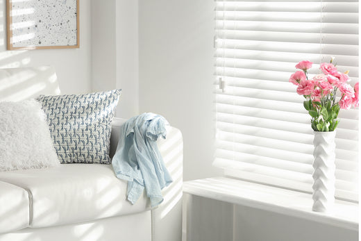 white mini blinds for indoor windows providing a refreshing ambiance