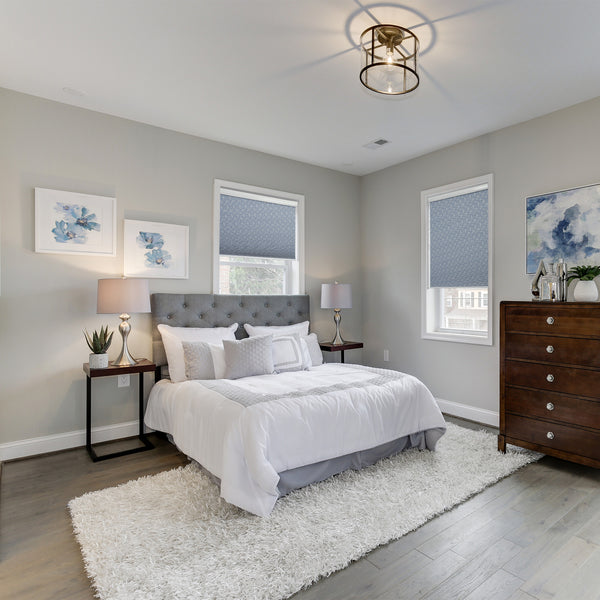 motorized blackout cellular shades in a bedroom