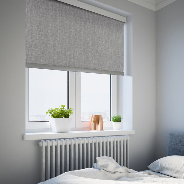 motorized room darkening roller shades in a bedroom