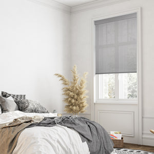 motorized fine-grained semi sheer sunscreen roller shades in a bedroom