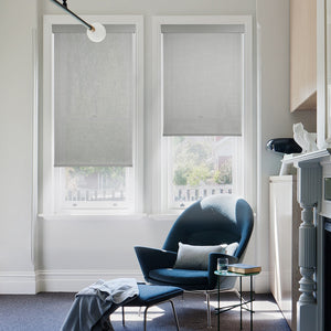 motorized fine-grained semi sheer sunscreen roller shades in a living room