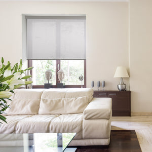 motorized coarse-grained semi sheer sunscreen roller shades in a living room