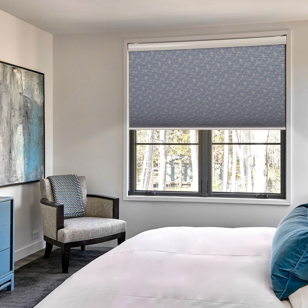motorized blackout cellular shades in a bedroom