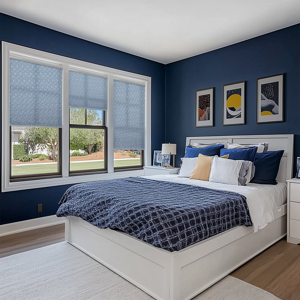 motorized light filtering cellular shades in a bedroom window