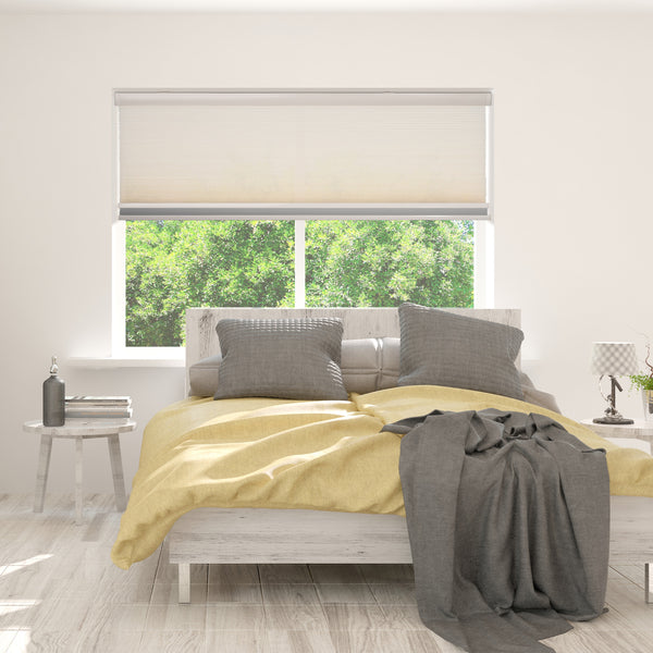 motorized openness day and night cellular shades in a bedroom