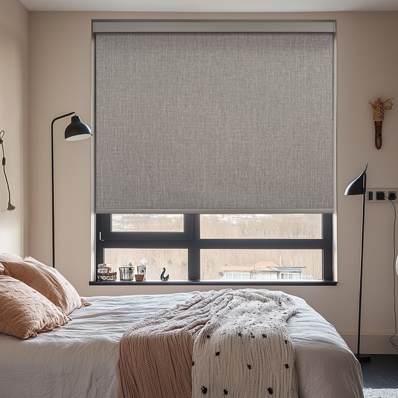 motorized blackout roller shades with square cassette in a bedroom