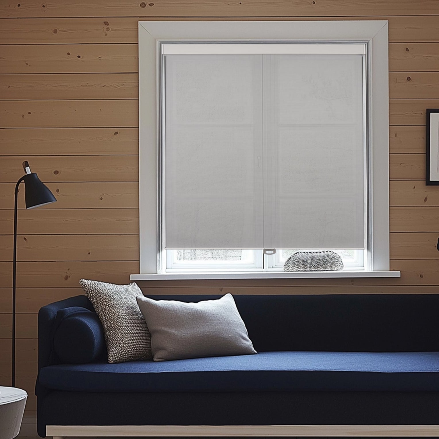 cordless light filtering waterproof roller shades in a living room window