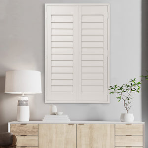 custom PVC plantation shutters in a window