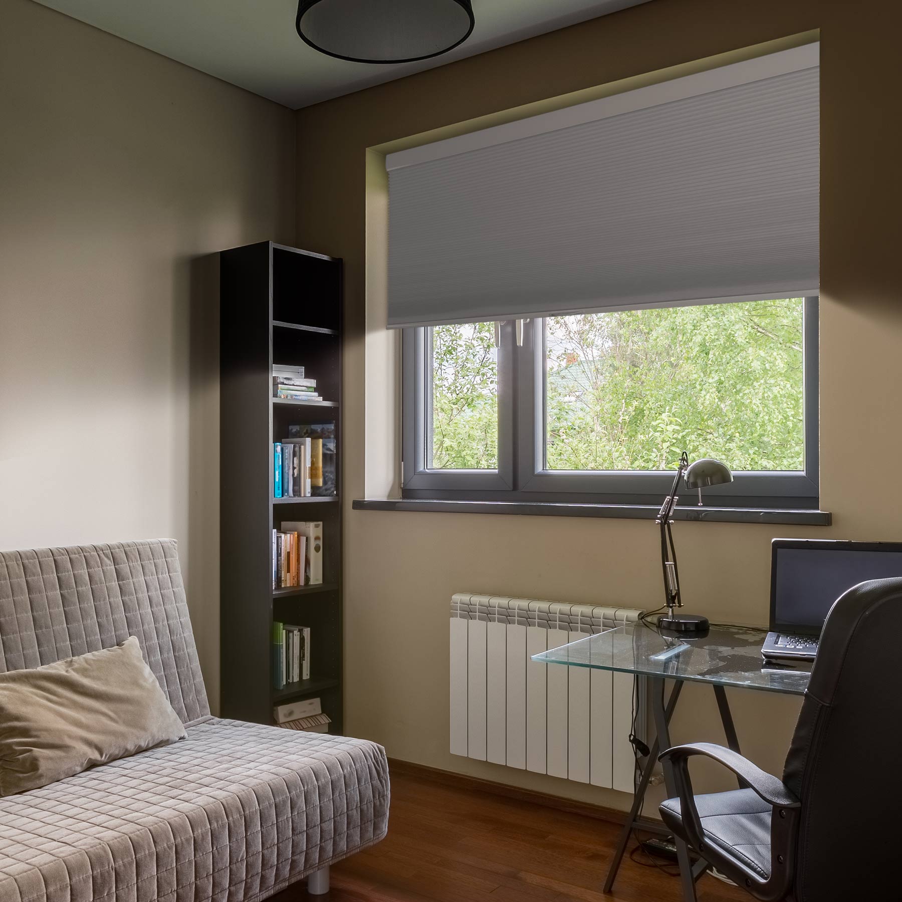 cordless blackout cellular shades for indoor windows in a book room