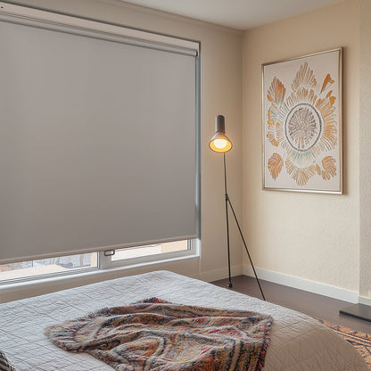 no-drill cordless blackout roller shades in a bedroom