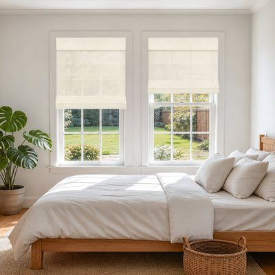 no drill light filtering natural linen roman shades in a bright modern farmhouse bedroom with a serene and airy feel | Hestia Blinds