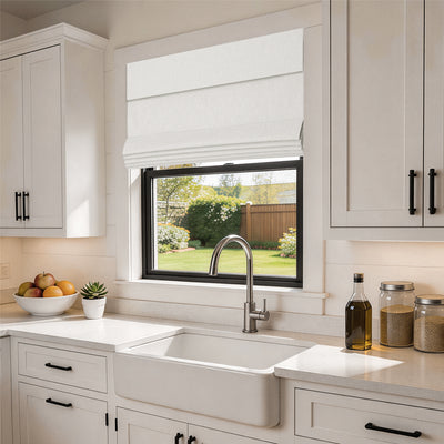no drill blackout faux linen roman shades in a clean, modern farmhouse kitchen with airy white interiors and soft sunlight filtering through | Hestia Blinds