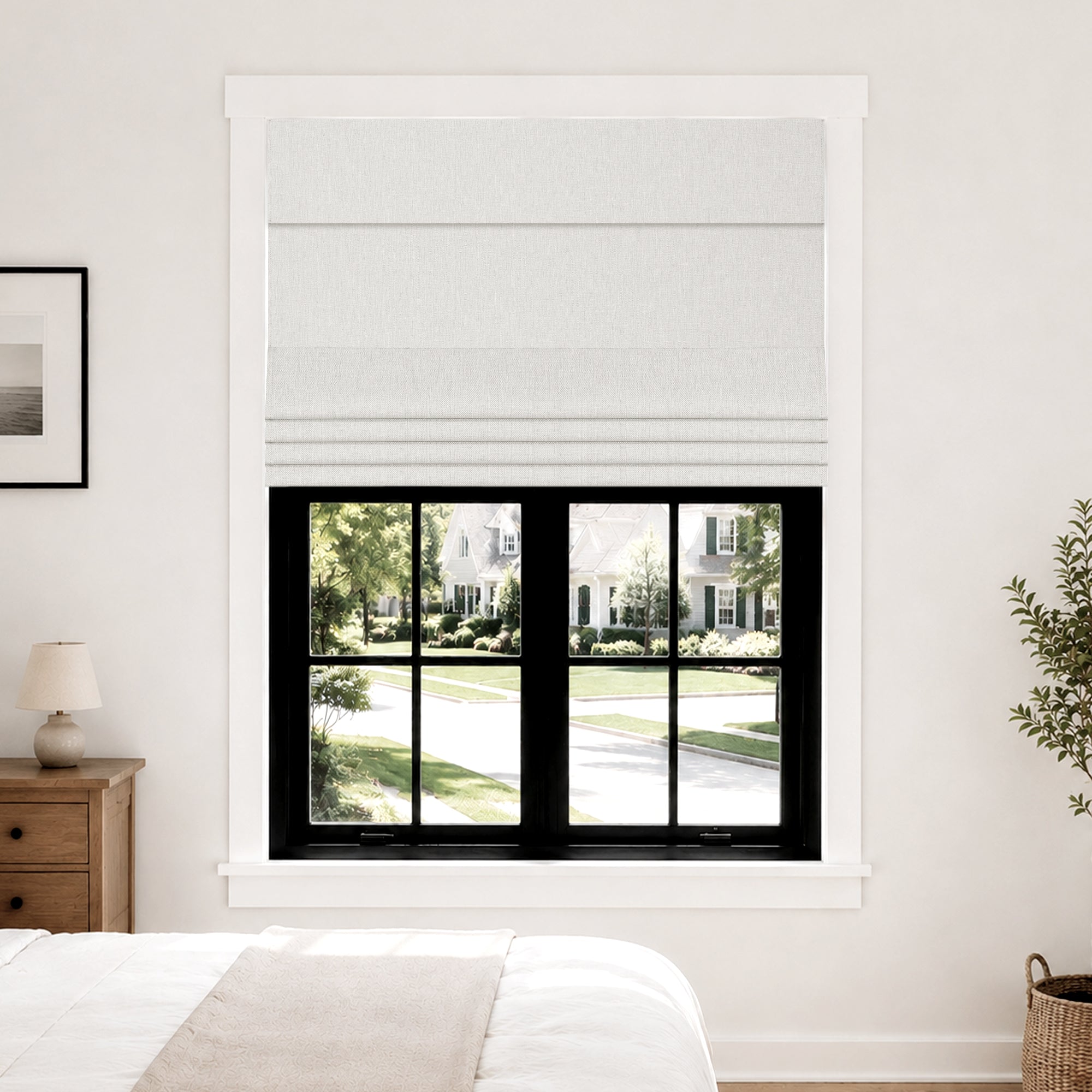 no drill blackout faux linen roman shades in pure white in a serene bedroom highlighting window-side details and natural brightness | Hestia Blinds