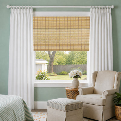 natural bamboo woven wood shades in a serene bedroom setting with layered sheers, offering balanced privacy, soft light filtering, and a calm breathable atmosphere | Hestia Blinds