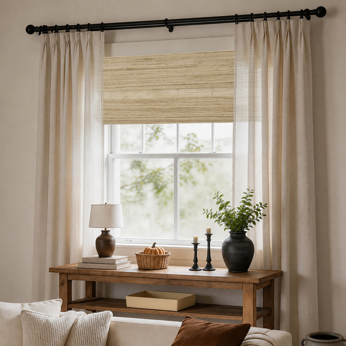 natural 100% ramie woven shades in a peaceful window-side lounge with sheer drapery, creating a clean, elegant, and restful atmosphere | Hestia Blinds