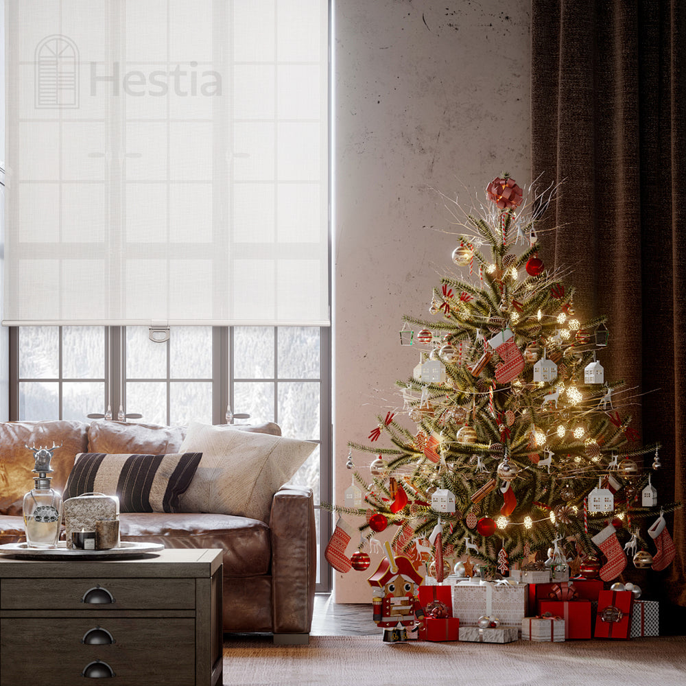 living room with roller shades and a festive Christmas tree